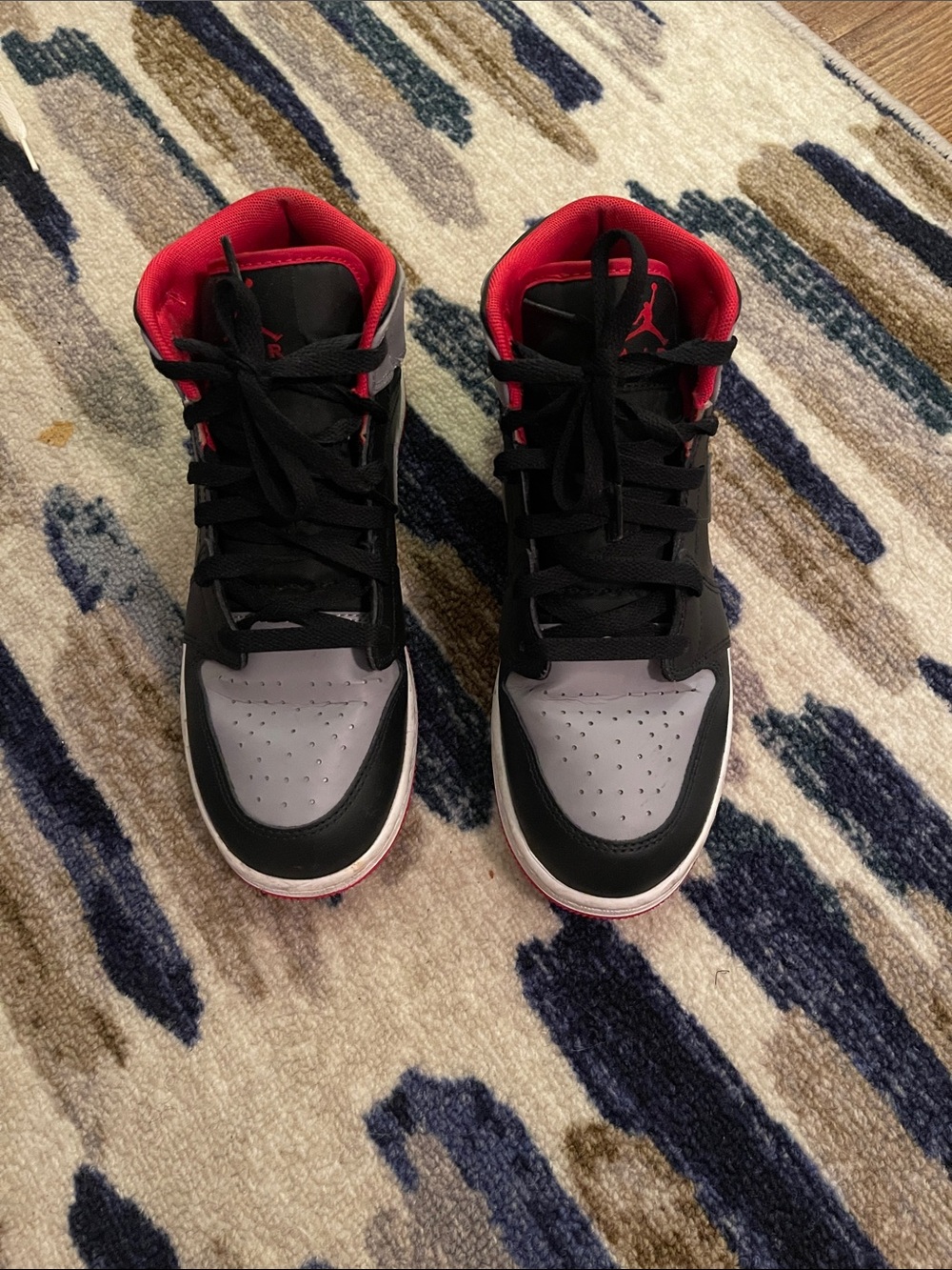 Jordan 1s Gray and Black High-Top Sneakers with Red Lining